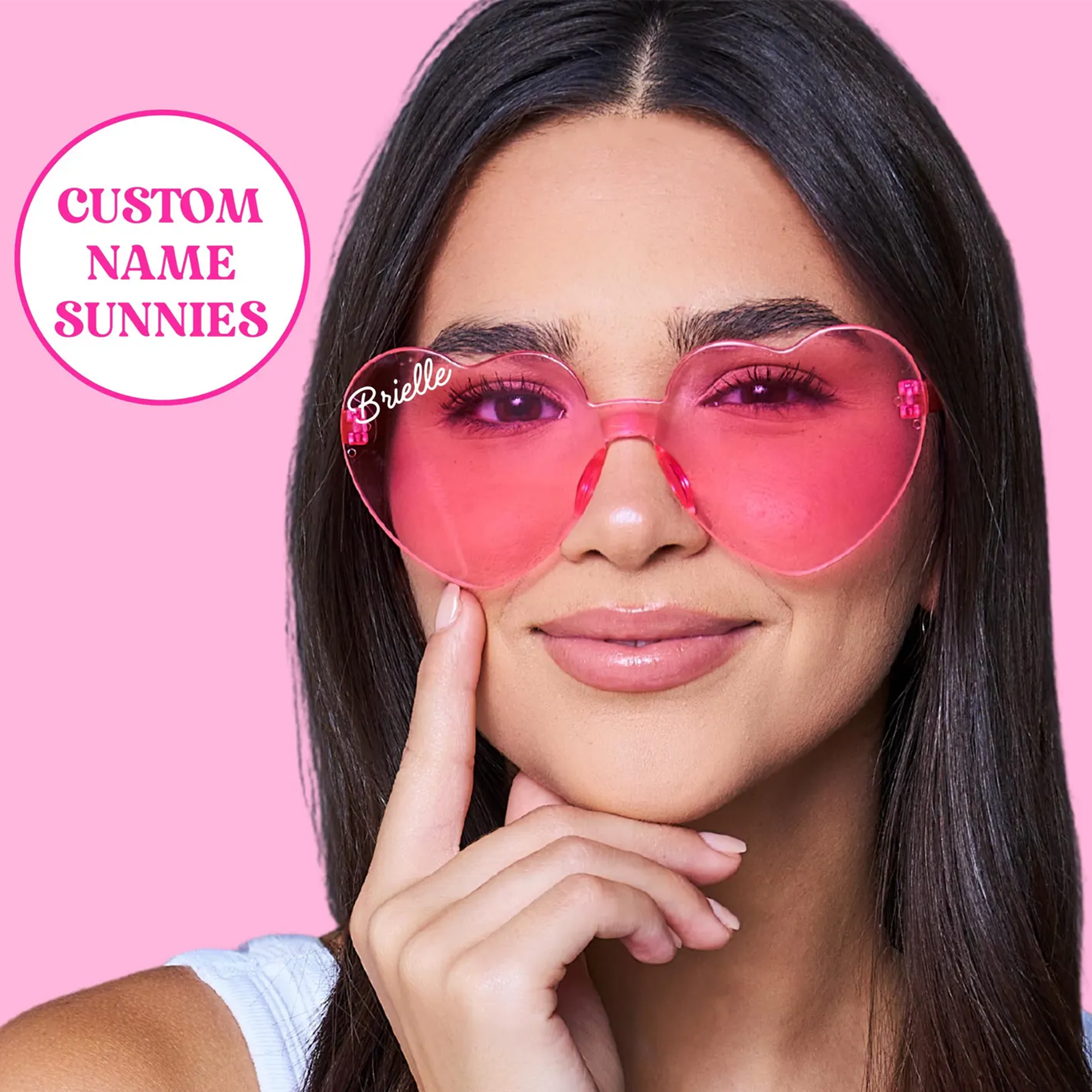 Woman wearing custom heart-shaped sunglasses personalized with her name on the left lens—perfect for birthdays, bachelorette parties, summer vacations, and fun party favors