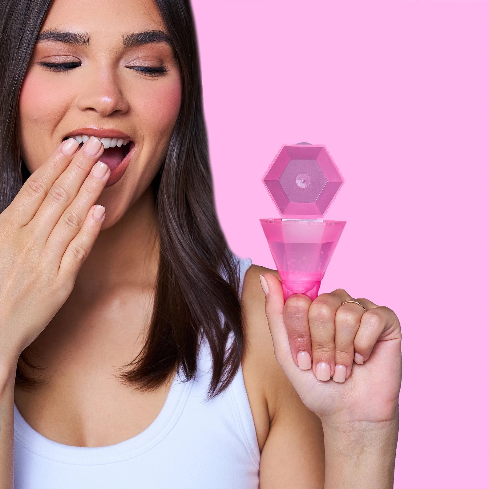 A plastic pink ring that doubles as an accessory and a shot glass. Diamond ring shot glass used for bachelorette party favors.