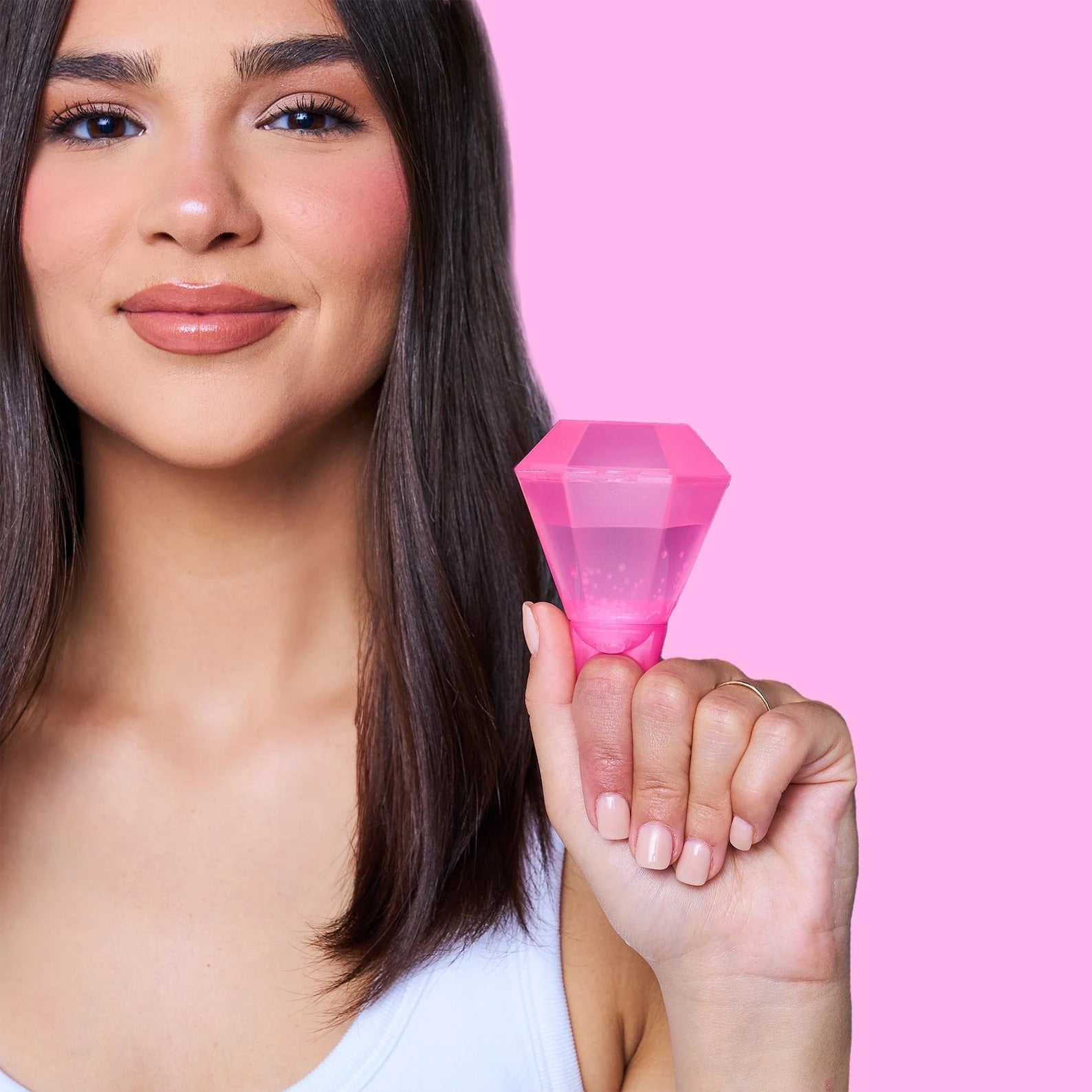 Pink plastic ring-shaped shot glasses for bachelorette party favors – fun bridesmaid accessory for proposals and engagement celebrations.